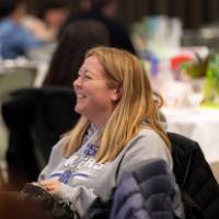 person sitting and smiling photo 2